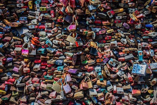 Cologne, Germany – June 04, 2023: A closeup of colorful locks piled on top of one another