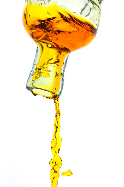 istock Amber Liquid Pouring Out Of A Bottle 157610192