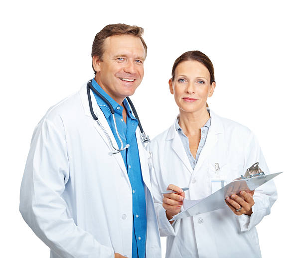 istock Smiling mature doctors with medical report against white 157610583