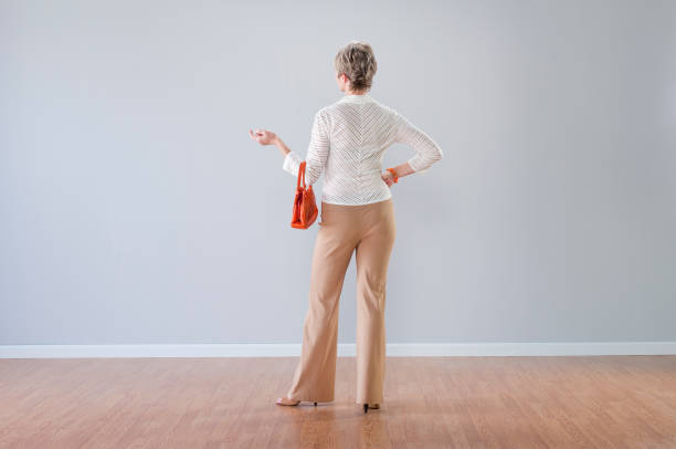 istock Stylish Woman Looking At Blank Wall 157610616