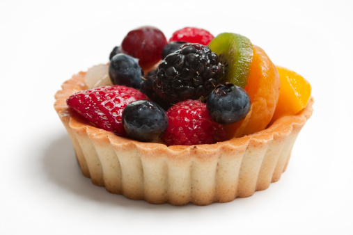 A delicious fruit tart made with strawberries, blueberries, grapes, blackberries, mango and kiwi.
