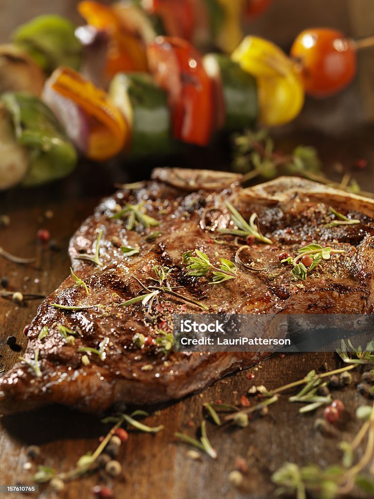 Porterhouse Steak with Fresh Herbs  T-bone Steak Stock Photo