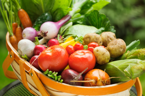 Top view of large group of healthy eating arranged side by side at the top of the image leaving a useful copy space at the lower side on white background. The composition includes a bowl of salad, fruits, vegetables, legumes, mushrooms and cereals.