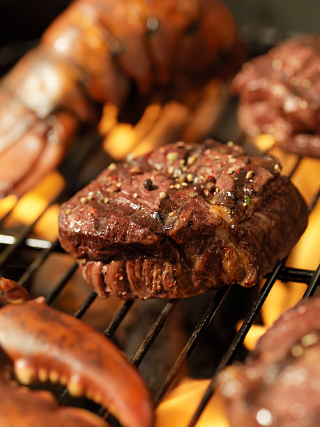 istock Steak and Lobster on an outdoor BBQ 157610806