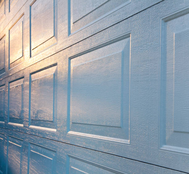 istock New Aluminum Garage Door Background; Textured Surface Reflecting Sunrise 157610815