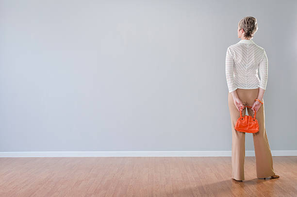 istock Stylish Woman Looking At Blank Wall 157610882