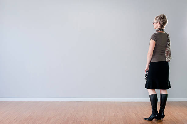 istock Stylish Woman Looking At Blank Wall 157610892