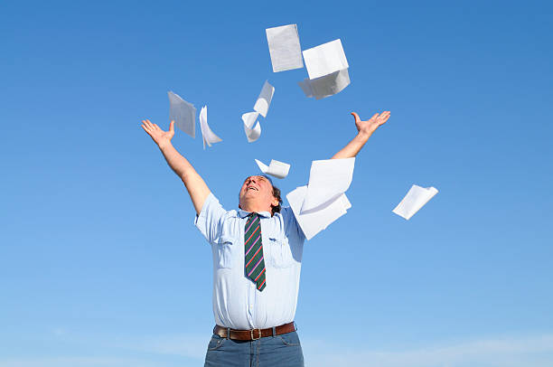istock Businessman Throwing Papers Blue Sky 157610943