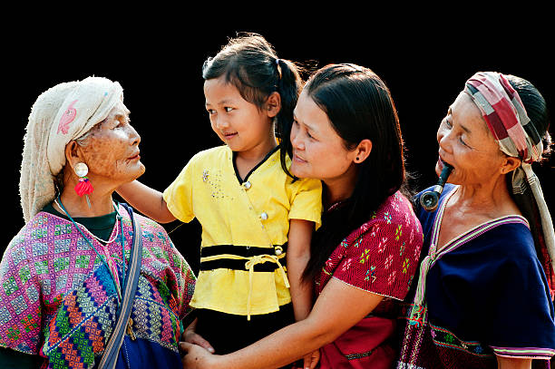 Four Generations of Po Karen Women Four generations of Po Karen women in a northern Thai village. Shot using available light. padaung tribe stock pictures, royalty-free photos & images