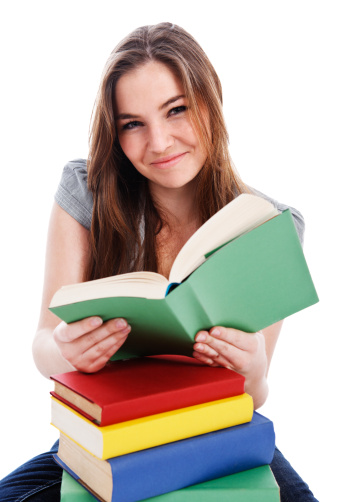 Female student sitting at a desk with books, isolated on white background
