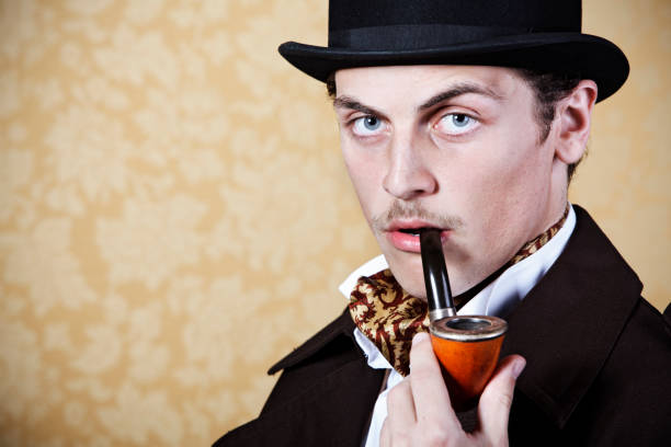 istock Man portraying Sherlock Holmes with pipe and hat 157611929