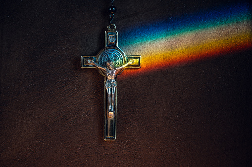 Crucifix with LGBT rainbow reflection