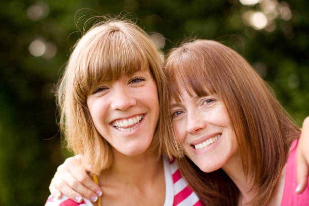 istock Smiling mom and daughter outdoors 157612085