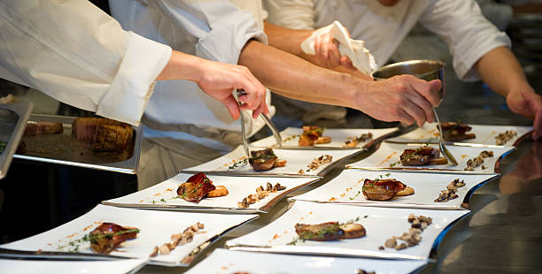 Chef`s dishing up the main course