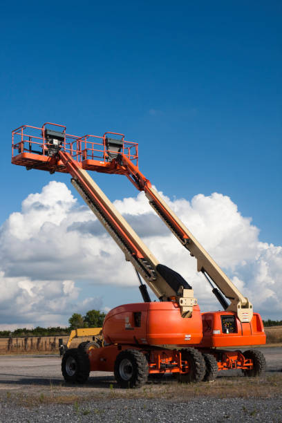istock Cherry Picker Lifts with Cloud Background 157612494