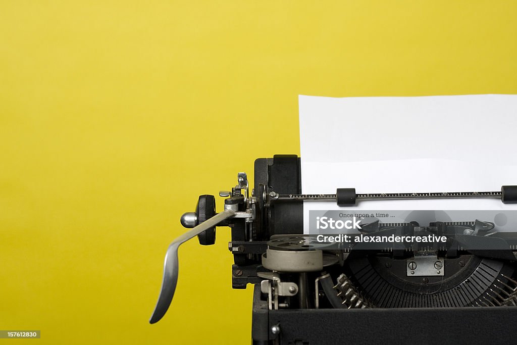 Once upon a time Close up shot of an antique typewriter with the phrase "Once upon a time…" typed on a sheet of paper. Typewriter Stock Photo