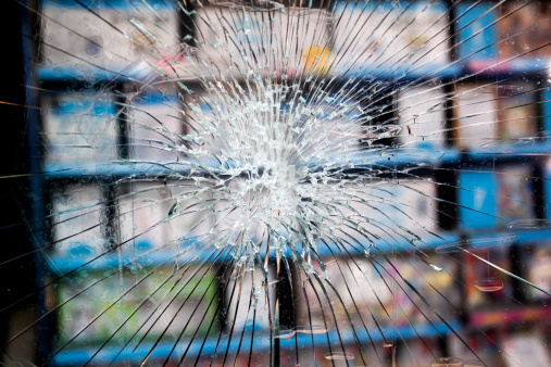 The felon who tried to break into this shop had no success - the toughened glass prevented it.