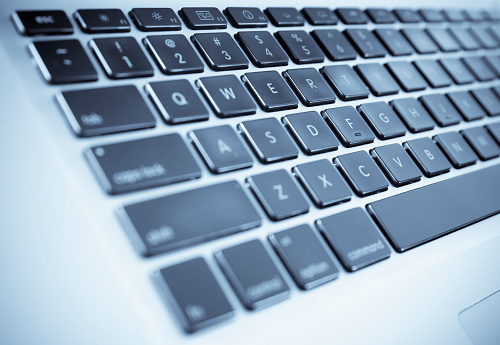 Laptop keypad with shallow depth of field and selenium tone added for effect.