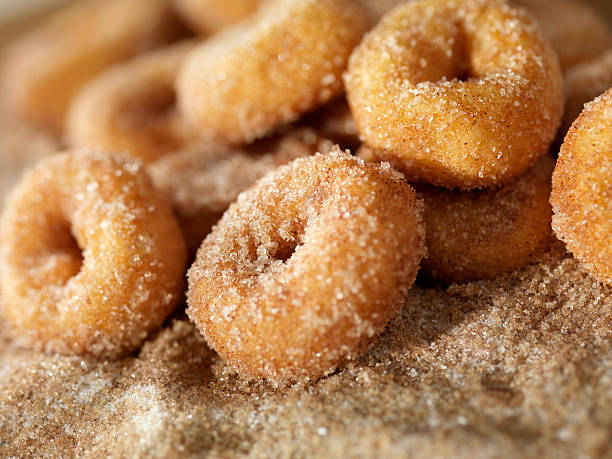 Cinnamon and Sugar Mini Donuts Cinnamon and Sugar Mini Donuts-Photographed on Hasselblad H3D2-39mb Camera donuts stock pictures, royalty-free photos & images