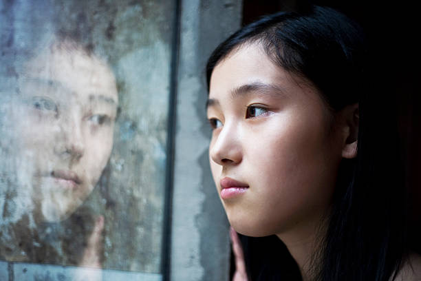 istock Asian girl inside the window 157613663