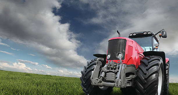 istock Tractor on the Green Field 157614074