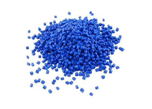 A stack of blue polymer granules isolated on white.