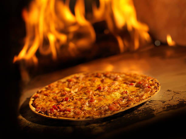istock Pizza in a Wood Burning oven 157614260