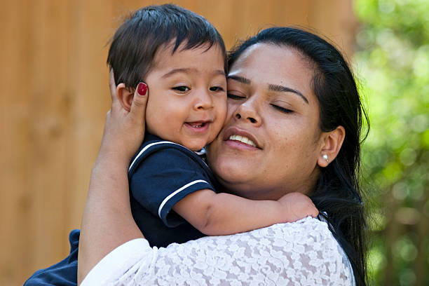 Young Hispanic mother with her son stock photo