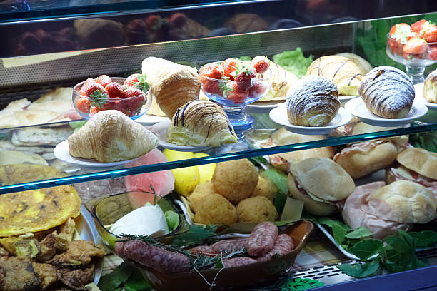 istock Cakes and savouries on display at food counter 157614459