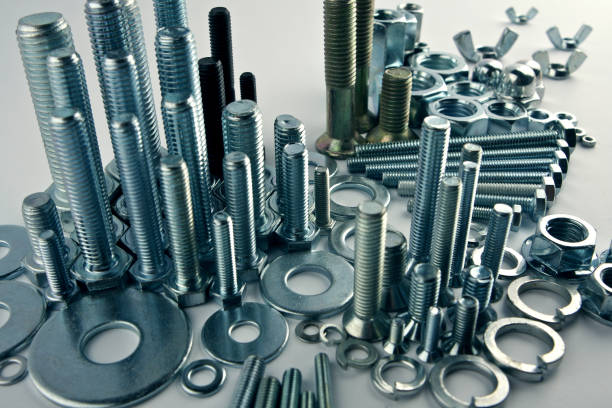 Mechanical city - constructional still life Bolts and nuts composed as a city with mechanical skyscrapers, financial district and infrastructure. Close-up shot. screw stock pictures, royalty-free photos & images