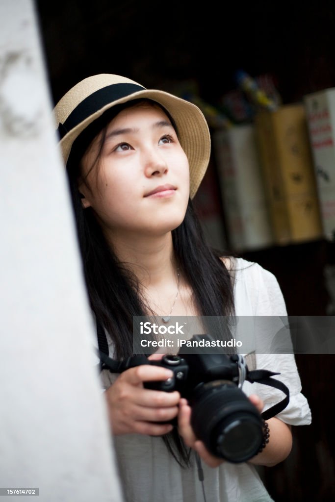 Travel with her camera  2000 Stock Photo