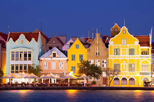 The coloured houses of Willemstad, Curaçao in the Netherlands Antilles by night.