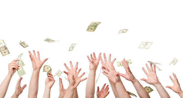 istock Several hands reaching out to grab dollars raining 157614777