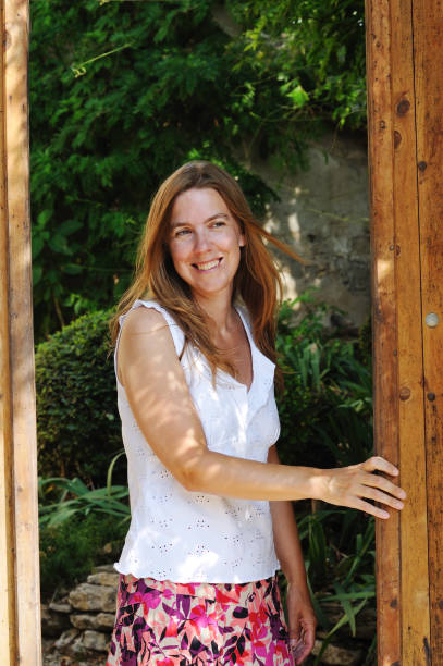 istock woman smiling in garden 157614782