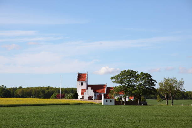 istock Idyllic country side parish church in evening sun 157614816