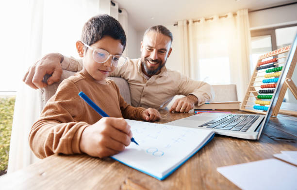 istock Math education, learning and father with child in home with book for studying, homework or homeschool. Development care, growth and boy or child with happy man teaching him how to count numbers. 1576149186