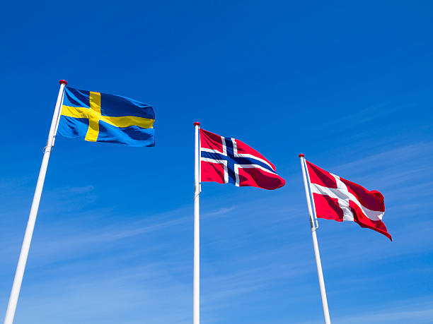The raised flags or Norway Sweden and Denmark stock photo