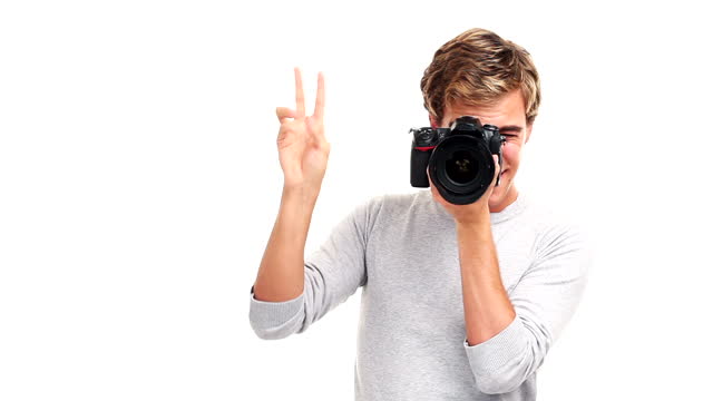 attractive photographer man taking photographs