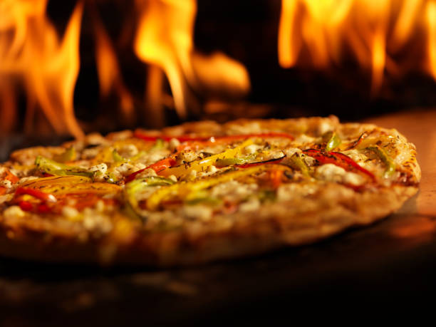istock Pizza in a Wood Burning oven 157615296
