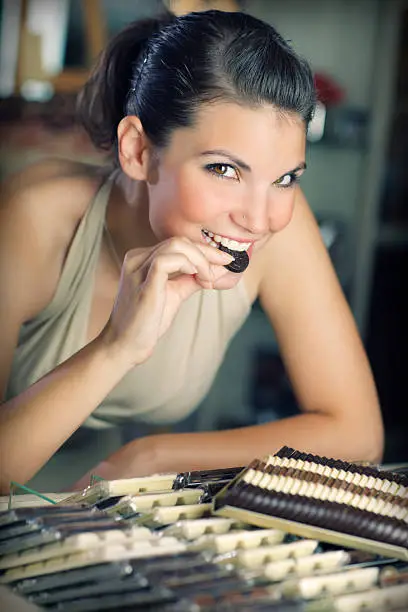 girl shopping and tasting  different chocolate goodies