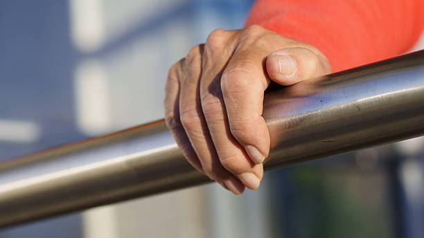 istock Senior Hand Grasps Stainless Steel Railing 157615579