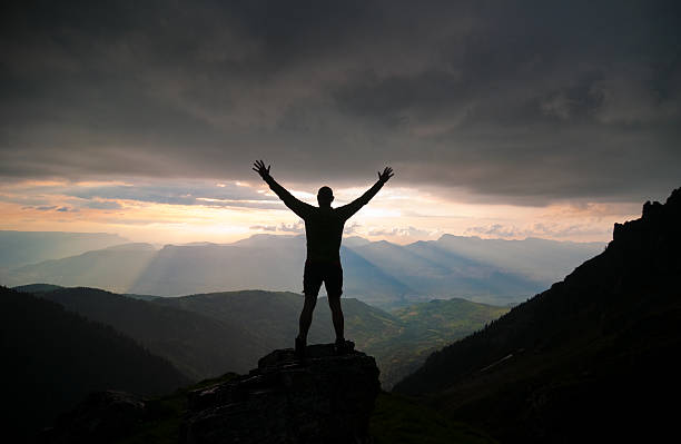 istock Man Silhouette against Spectacular Nature Sunset 157615860