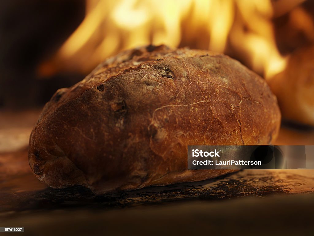 Cranberry Sourdough Bread in a Wood Burning oven Cranberry Sourdough Bread in a Wood Burning oven -Photographed on Hasselblad H3D2-39mb Camera Baking Bread Stock Photo