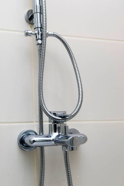 istock Close-Up Shower Faucet in Bathroom 1576162020