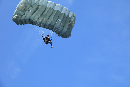 Parachutist in air