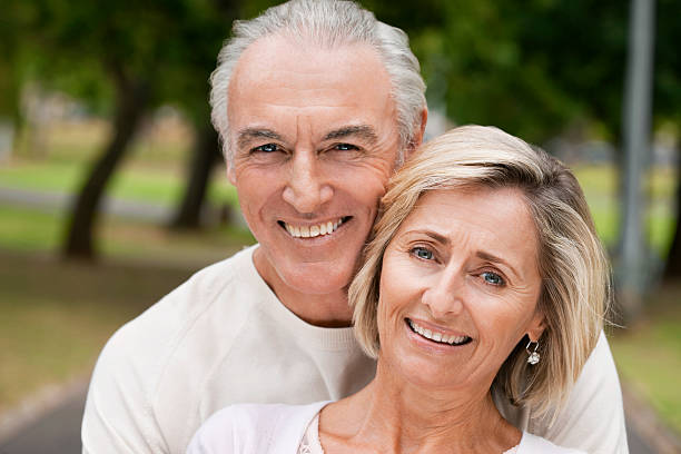 istock Smiling Senior Couple In Park 157616419