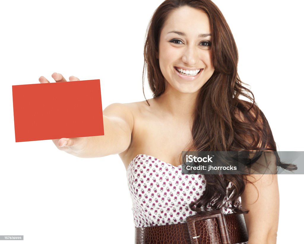 Attractive Young Woman with Blank Gift Card Photo of an casual young woman showing a blank red credit gift card; isolated on white. Credit Card Stock Photo