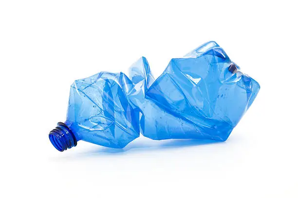 Photo of crushed blue plastic bottle