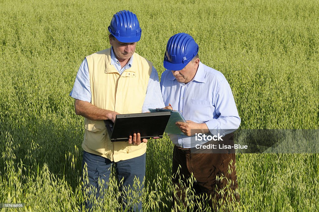 Geologist and Engineer with Laptop in the Countryside  Geologist Stock Photo