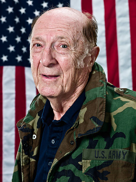 istock Ninety Year Old World War II Veteran by US Flag 157617687